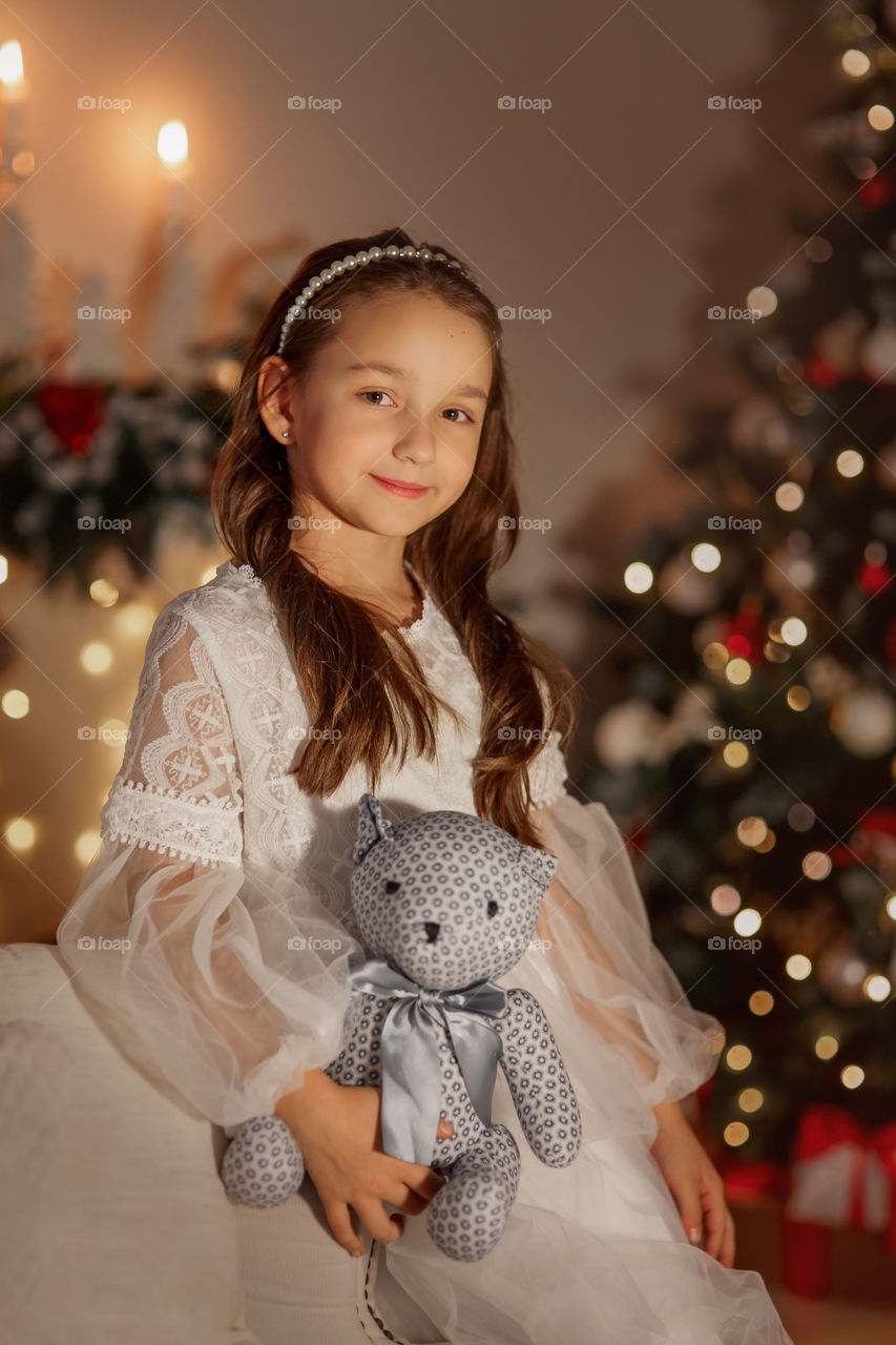 Girl in white dress at Christmas Eve 