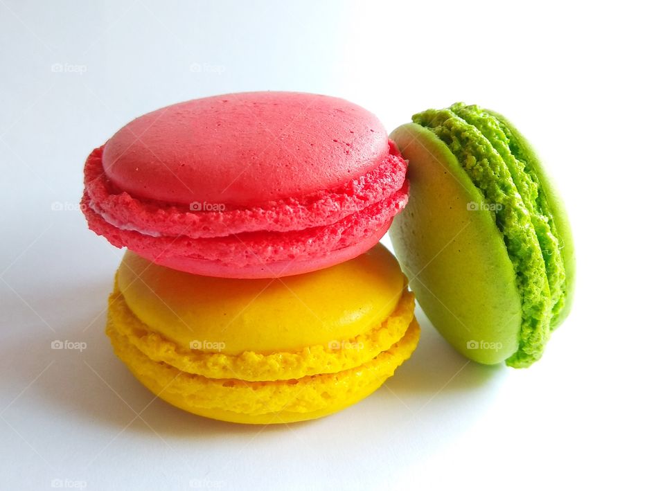 Color macaroon cookies on white