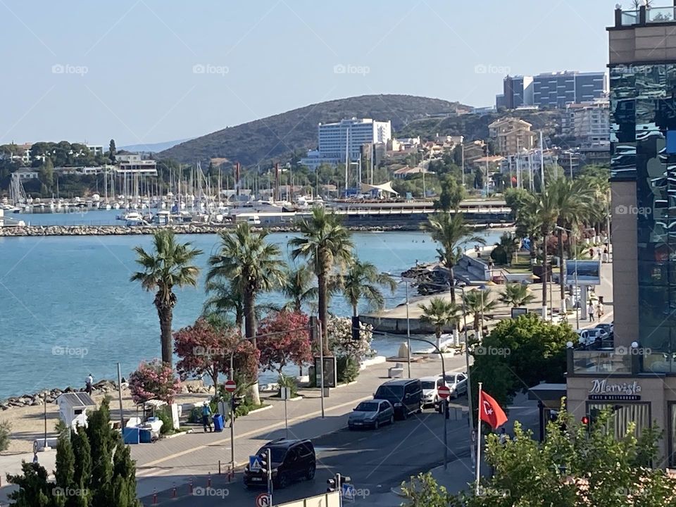Empty streets in the sunny kusadasi Turkey. Palms and empty roads. Summertime photo. Holidays adventure.
