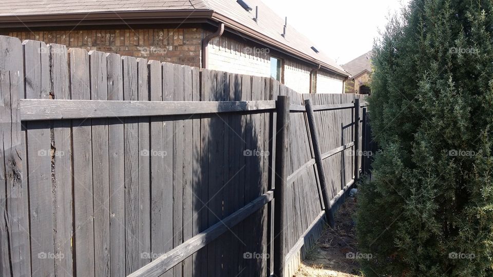 Fence work. Leaning fence 