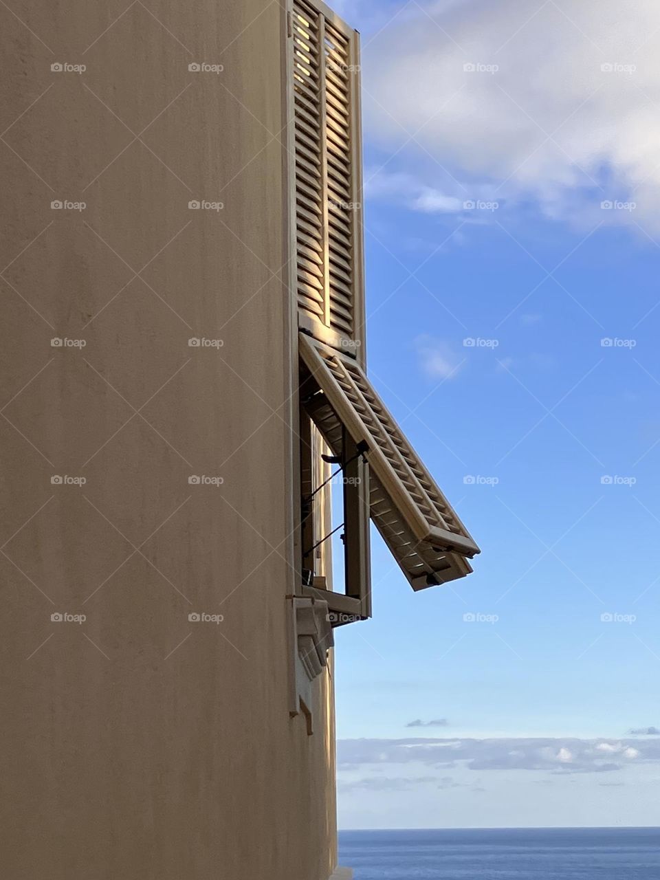 Shutters semi-opening on sea