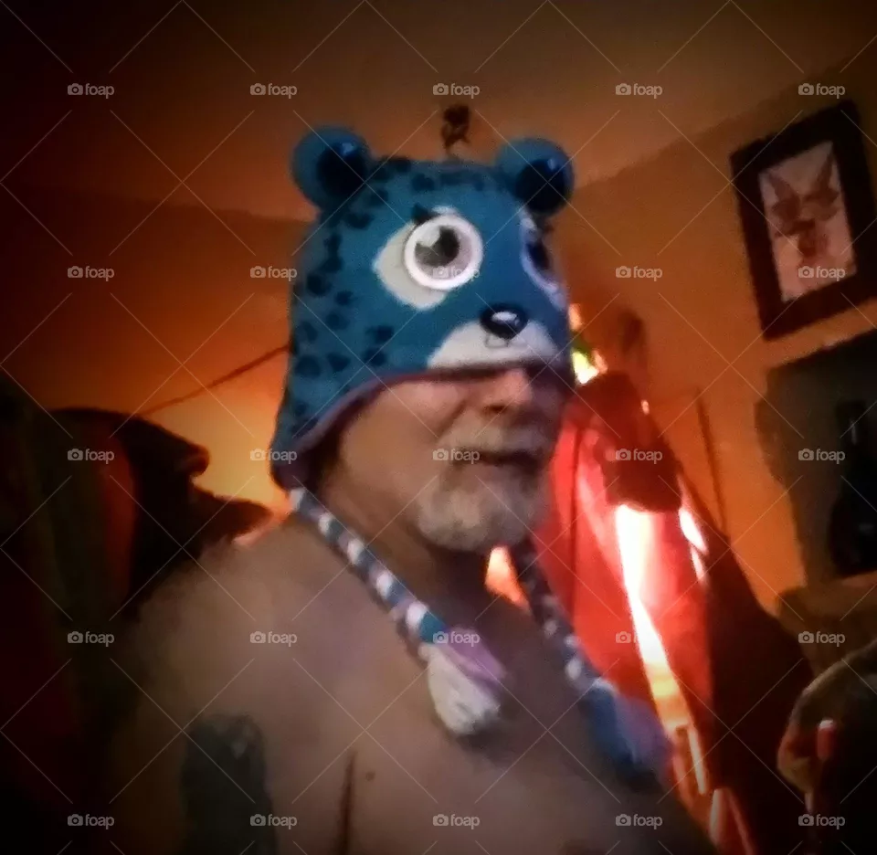 People, a man wearing a animal face stocking hat, goofy smile, just playing around