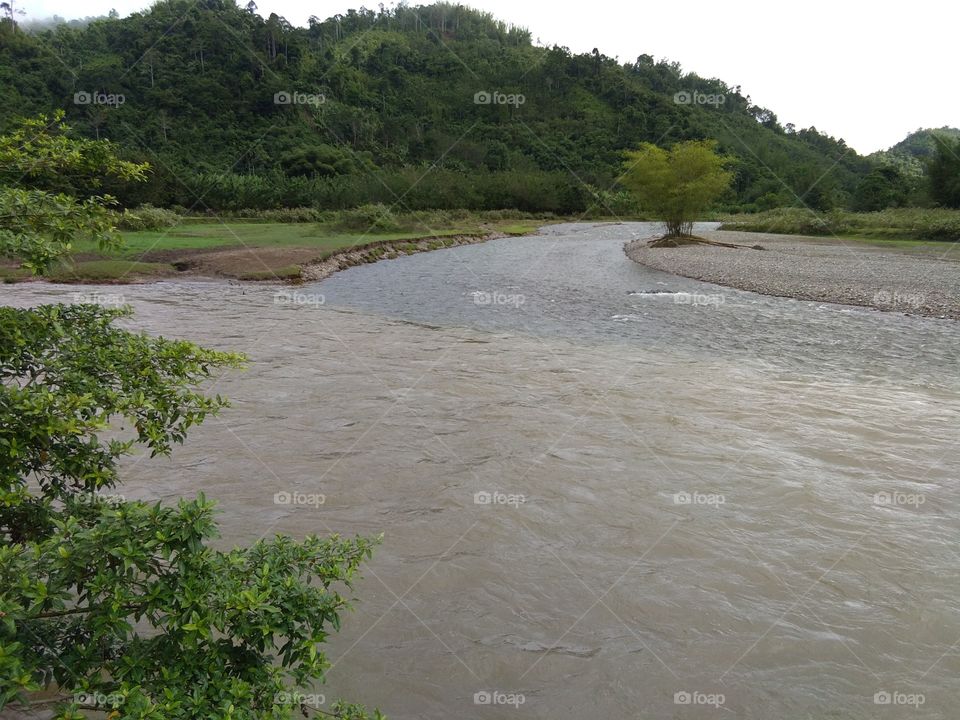 Two river meet point. one is flood and the one is clear. river source come from diffrent mountain