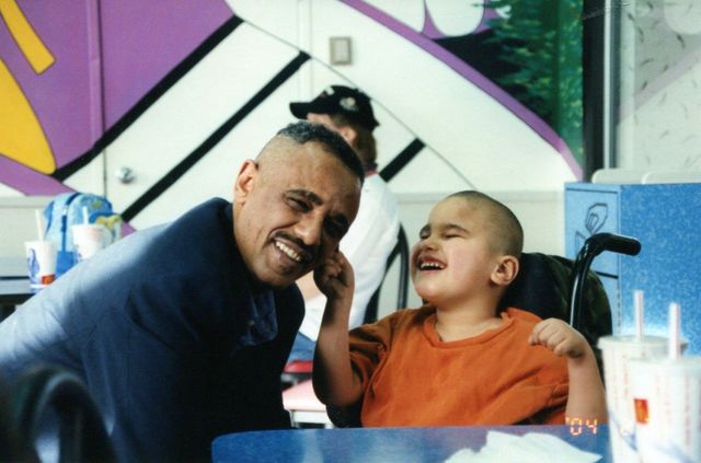 Pulling his ear