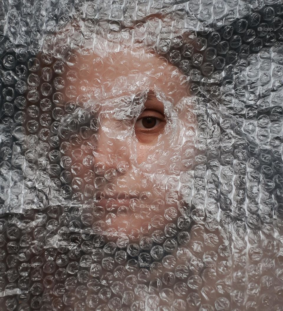 Portrait of a girl with wrapping film