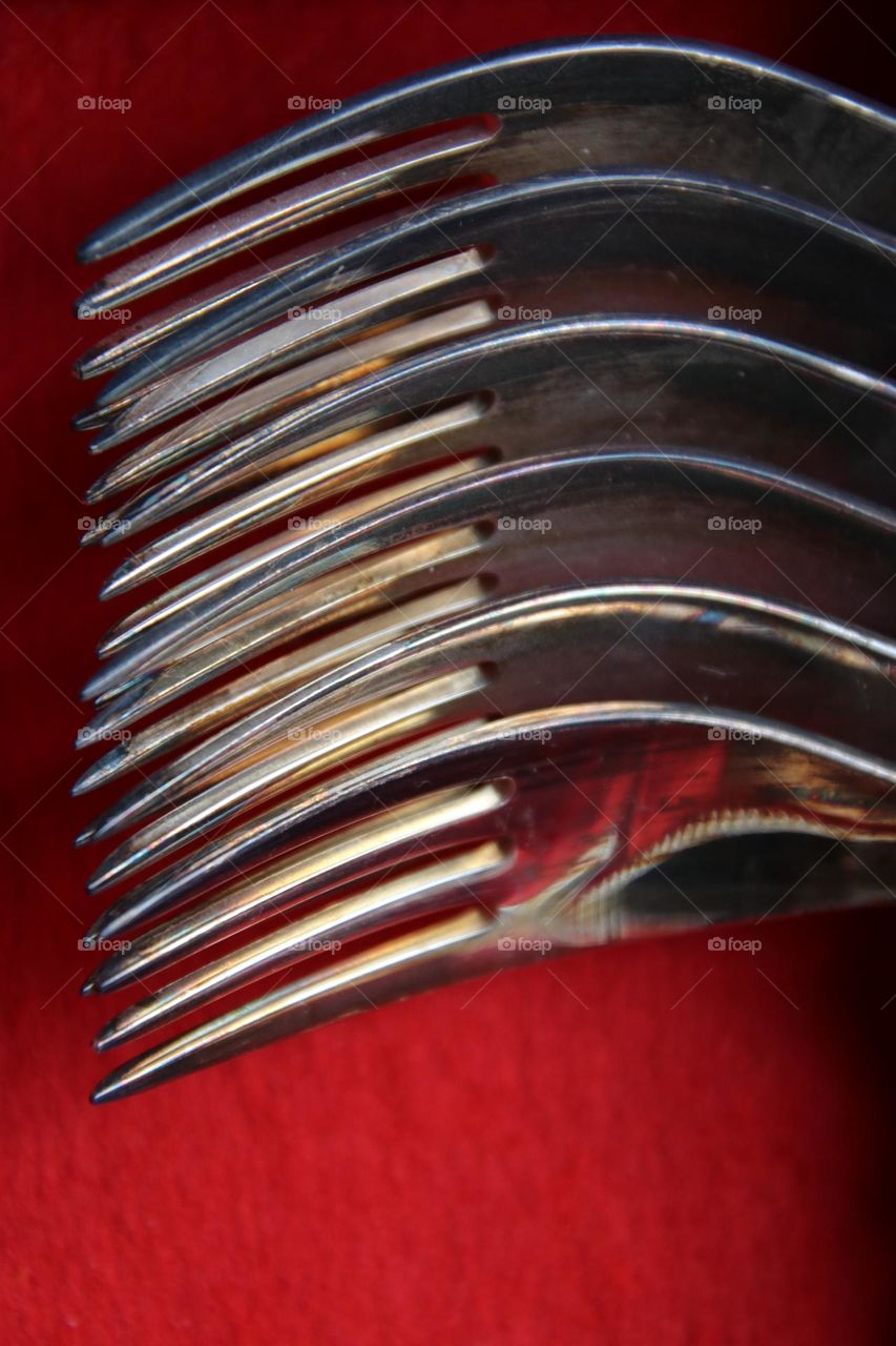 Close up of silver forks in red box 