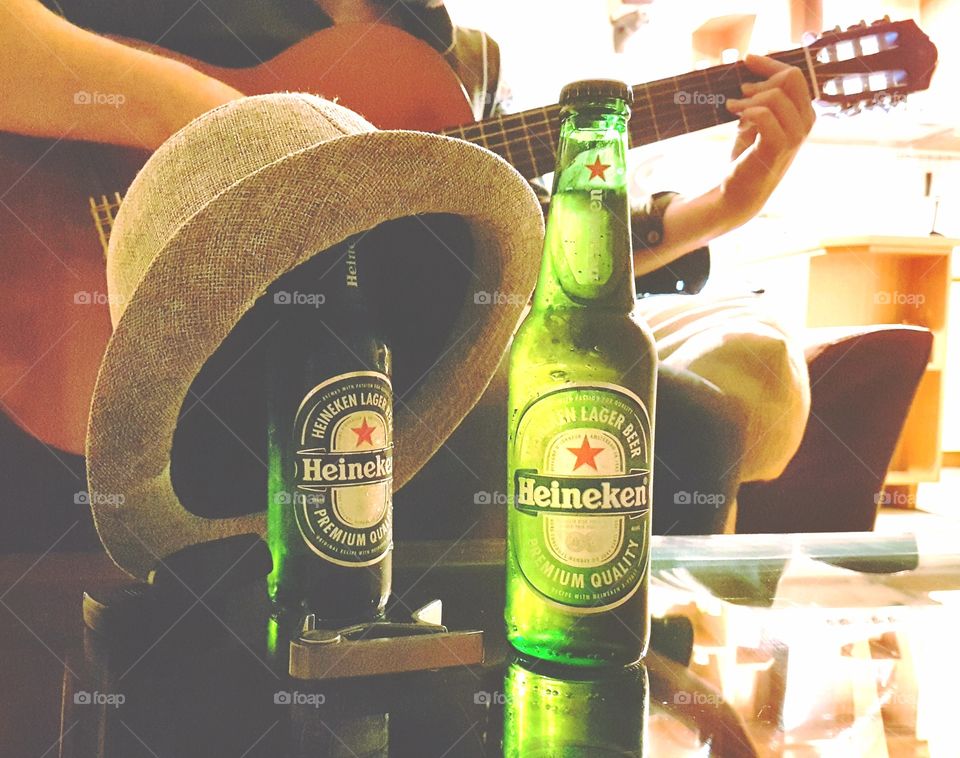 Two beers, guitar and hat