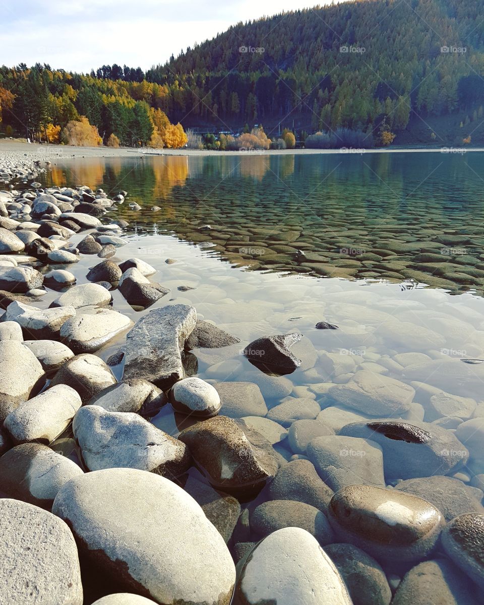 Calm pebbles by the lakeside of Tekapo
