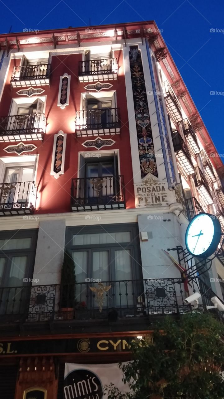 Illuminated building of Spanish architecture in Madrid Spain.
