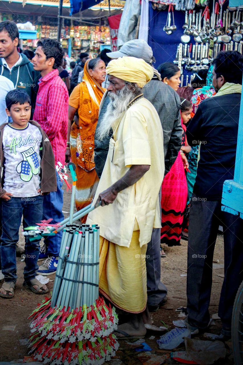 selling toy by an old person in the market