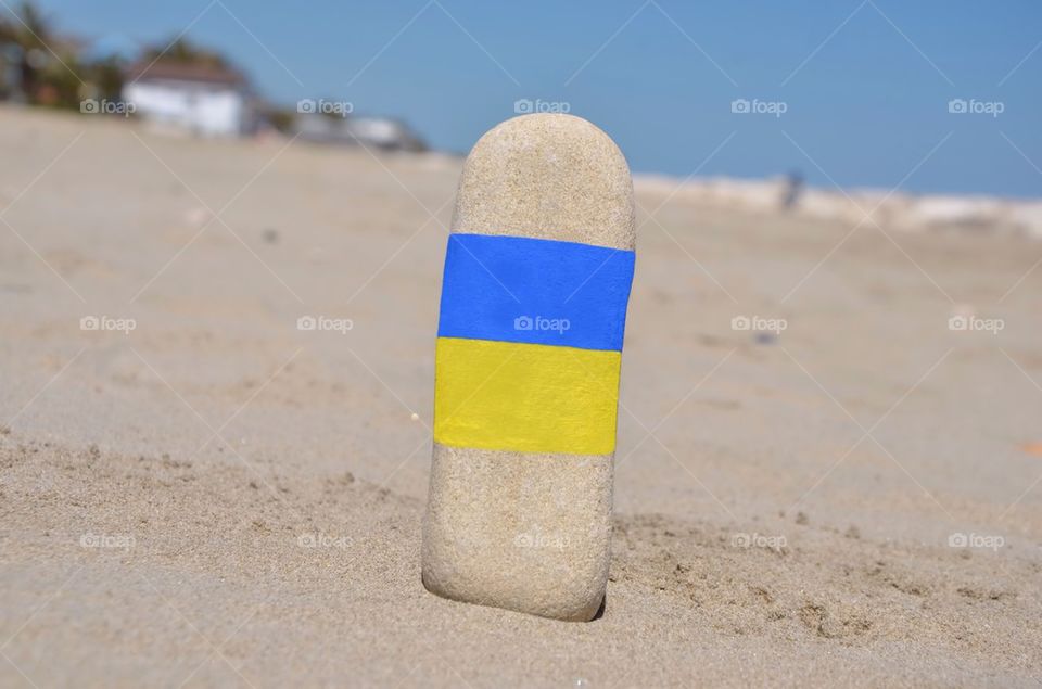National flag of Ukraine on a vertical stone