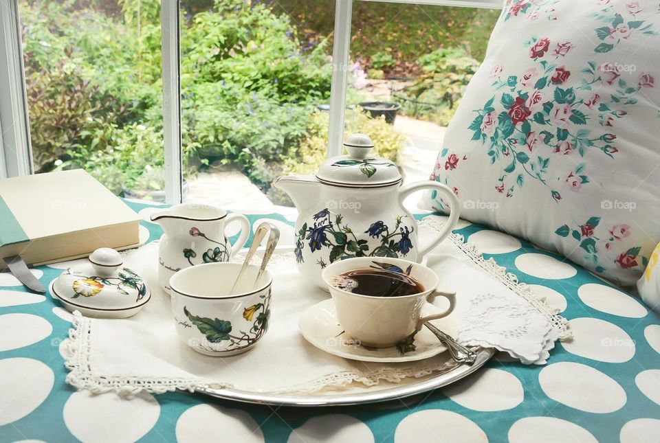 Window seat with vintage coffee service