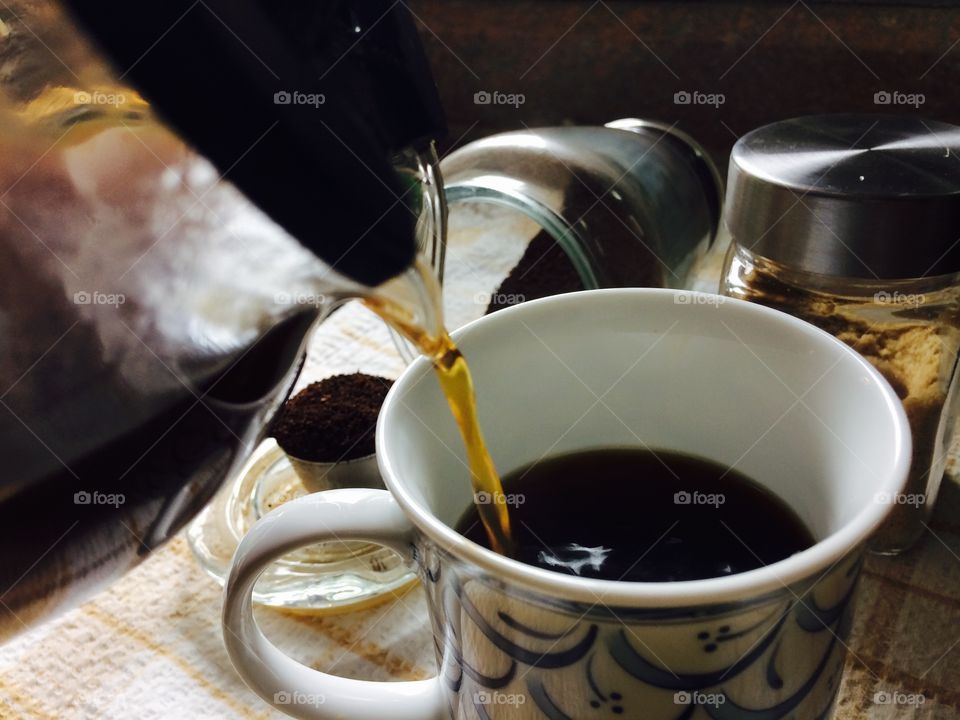 Coffee pouring in the cup