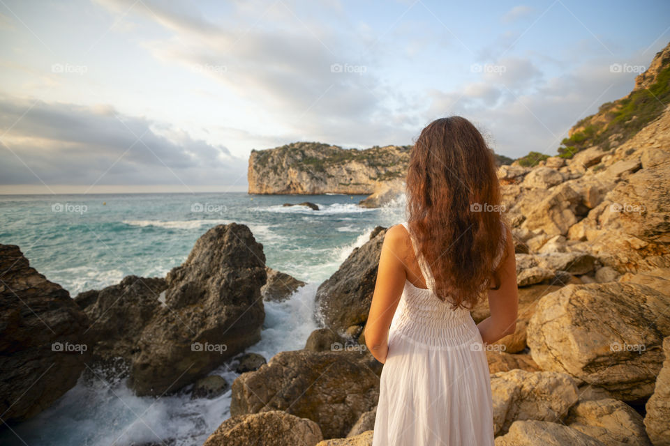 Summer vacation.
Girl is looking in beautiful sea