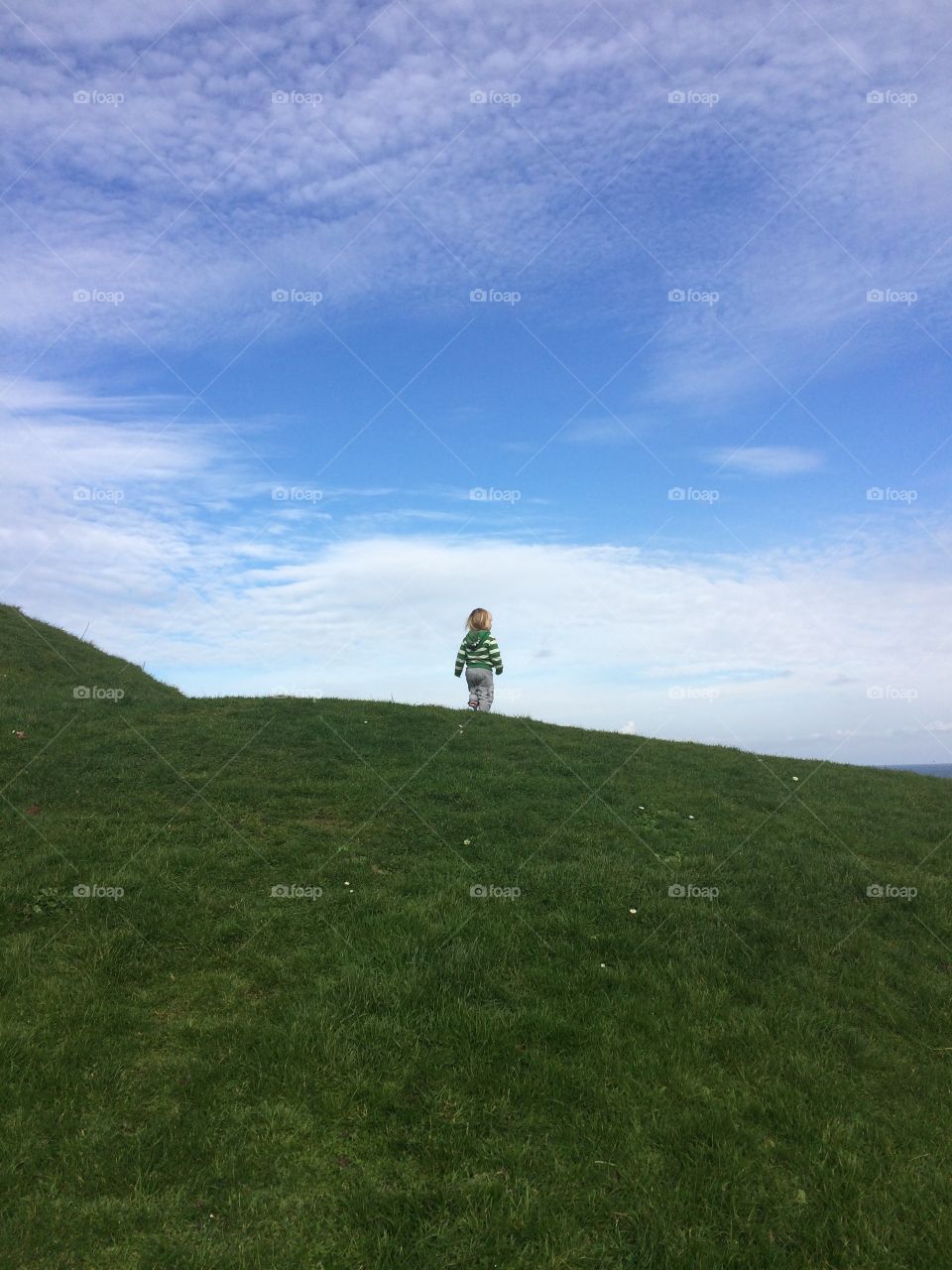The boy is on top - happily between the green and blue 