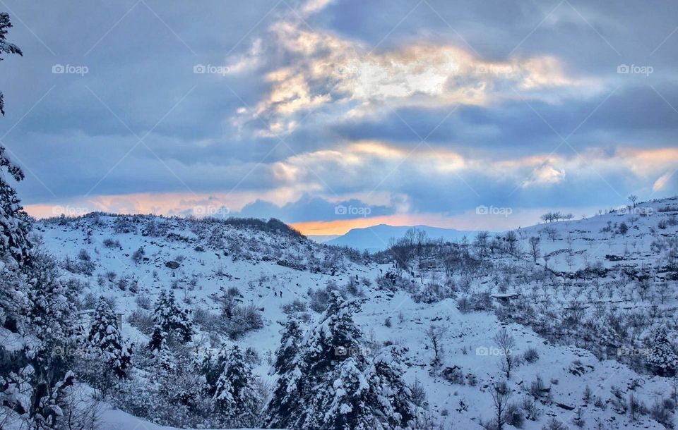 Clouds hugging the sun