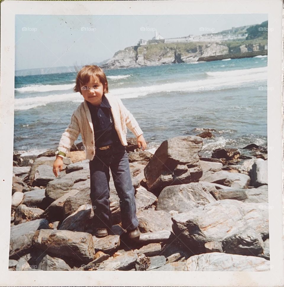 Child walking on the rocks