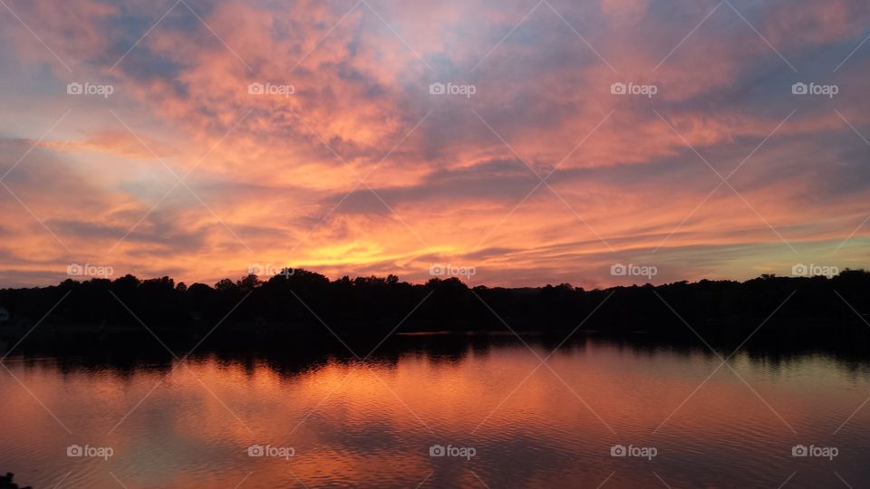 Scenic view of a lake at the time of sunset