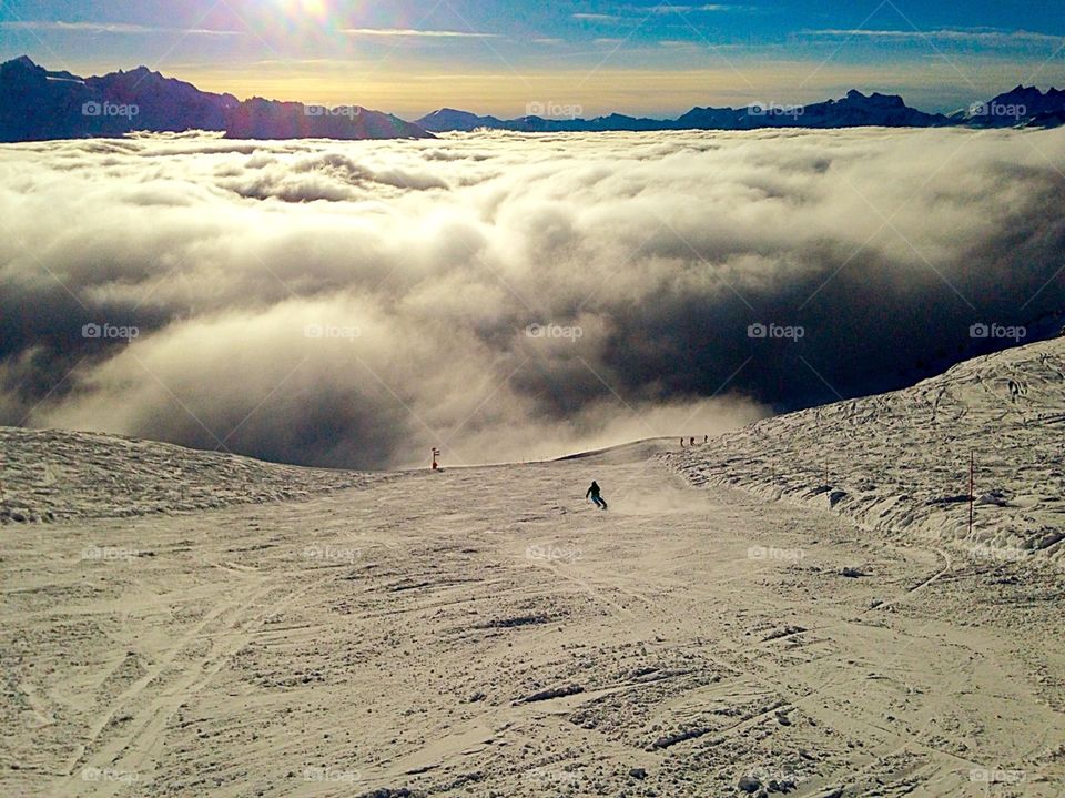Skiing above clouds