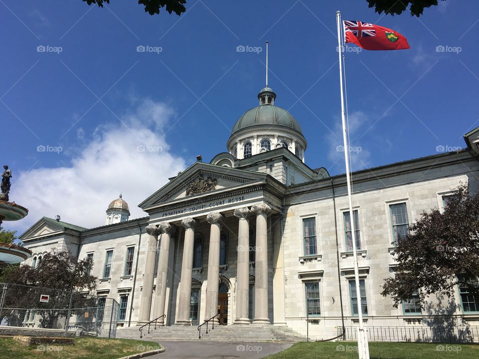 The old courthouse in Kingston Ontario on a hot summer day with a cool breeze waving the flag! 