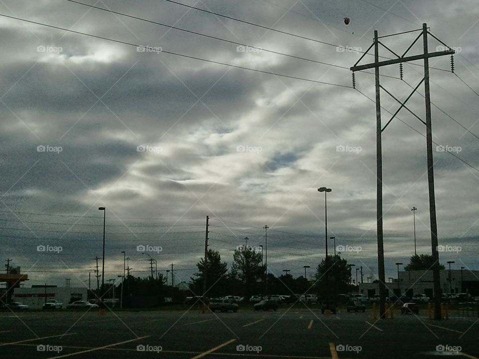 Cloudy Parking Lot. A parking lot under a dark cloudy sky.