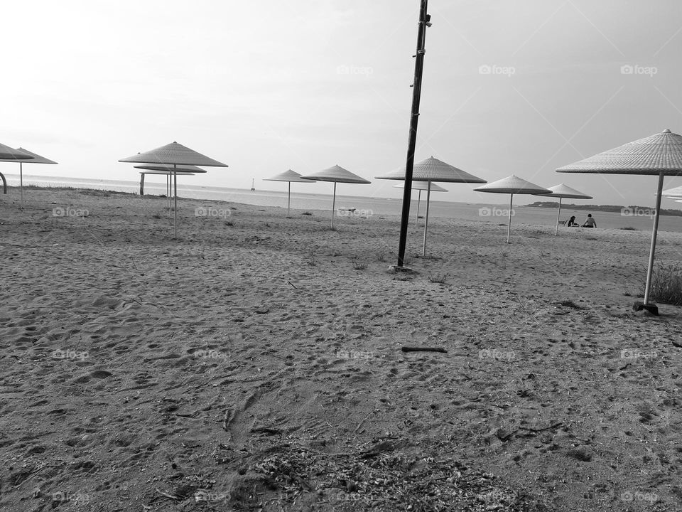 Beach umbrella placed on the sand in a fine art style