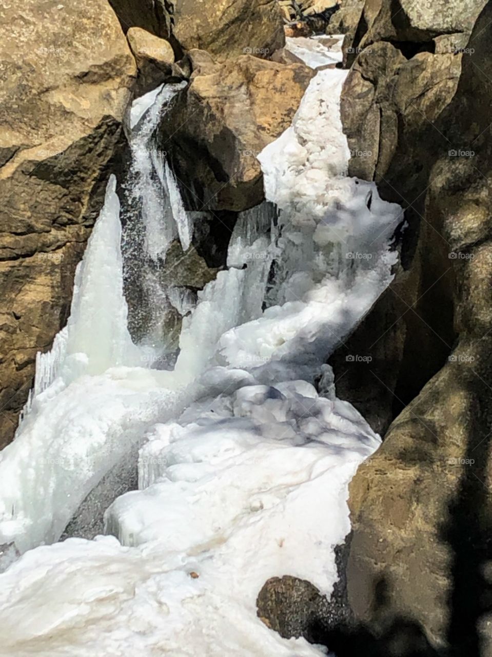 Partly frozen waterfall at Boulder Falls just west of Boulder, Co.