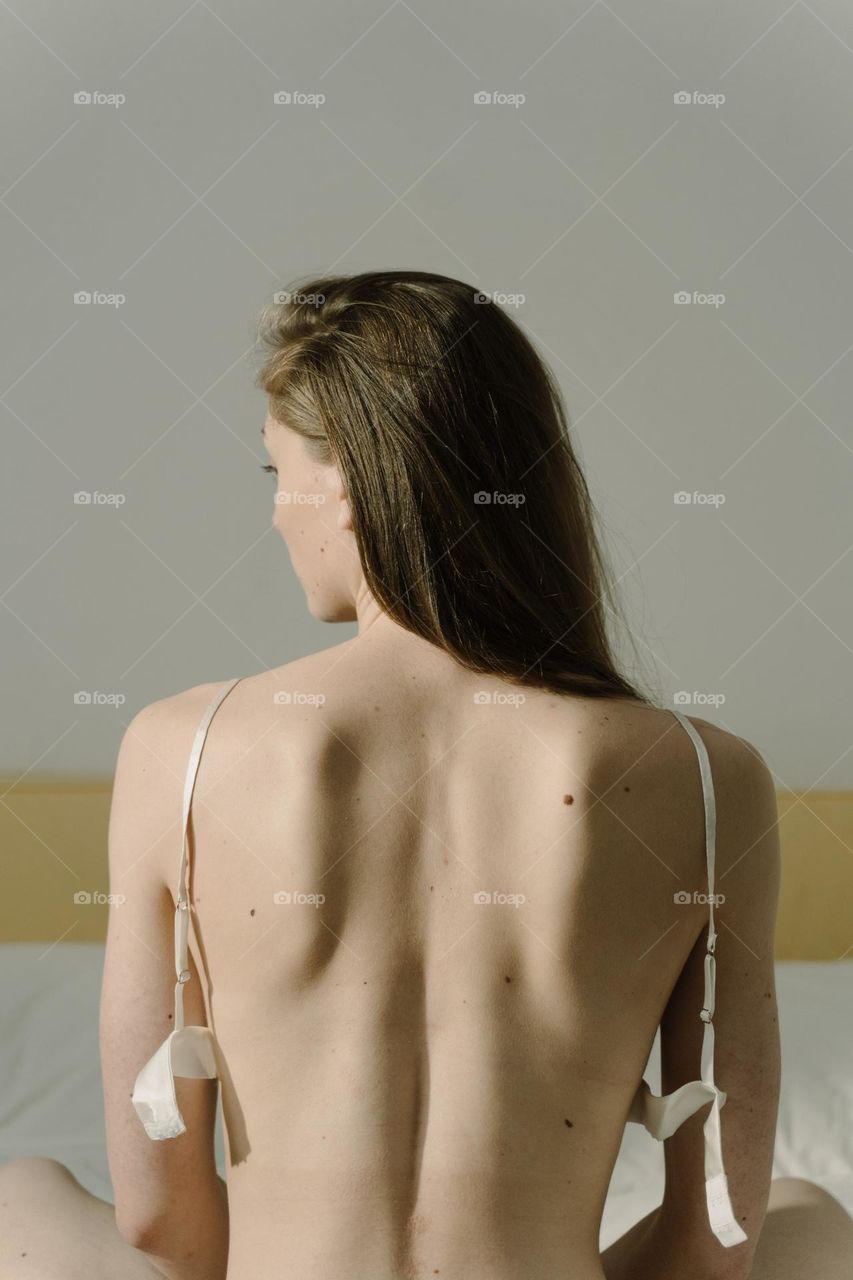 a hot woman who undresses