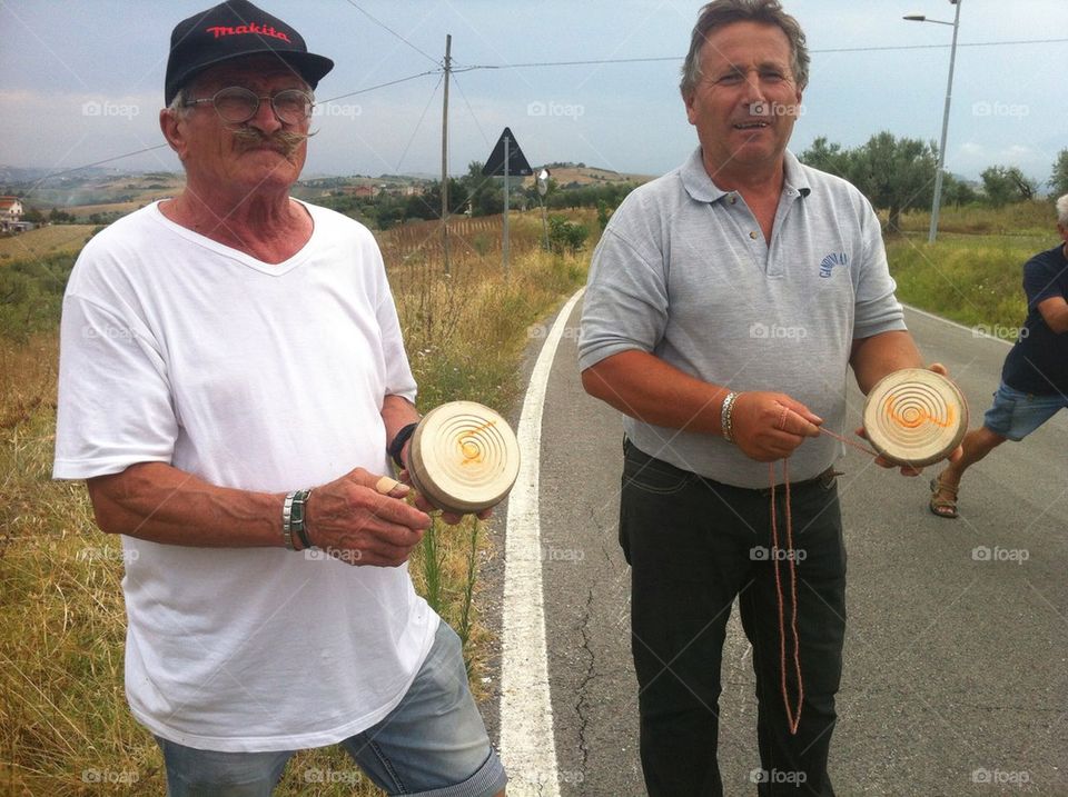 Players of ruzzola su strada, traditionaland old italian game