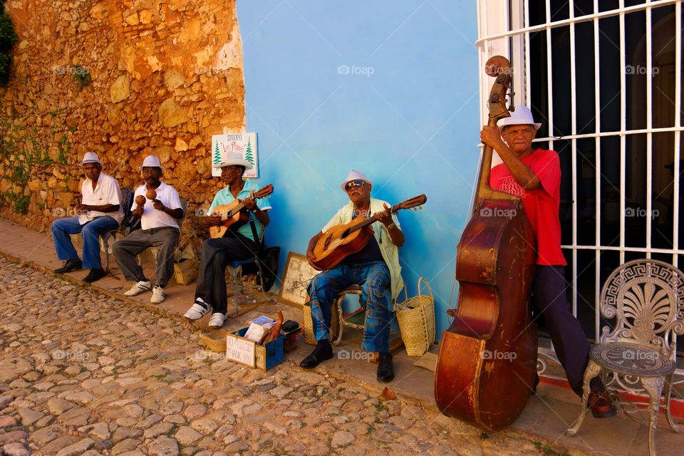 Street musicians in Trinidad, Cuba. A street band playing hot salsa in the streets of historic Trinidad, Cuba on Christmas Eve 2013