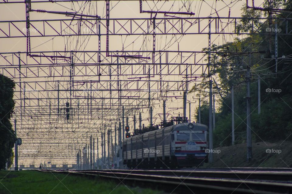 Old city electric train under web of wires and beautiful sky😍