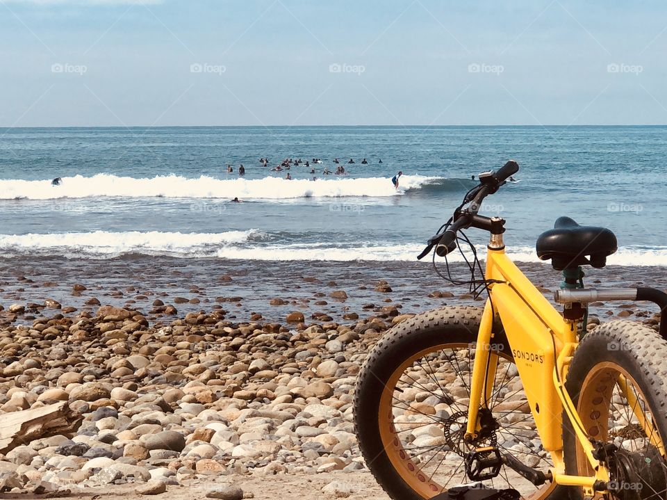 Yellow Bicycle on Beach With Waves and Surfers in Background, Lifestyle Photography 