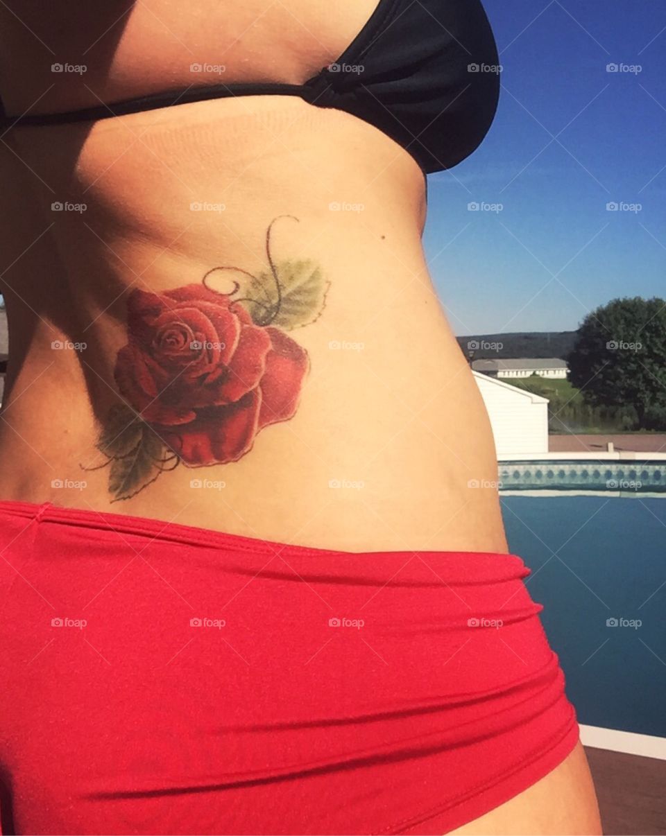 Red rose tattoo. 