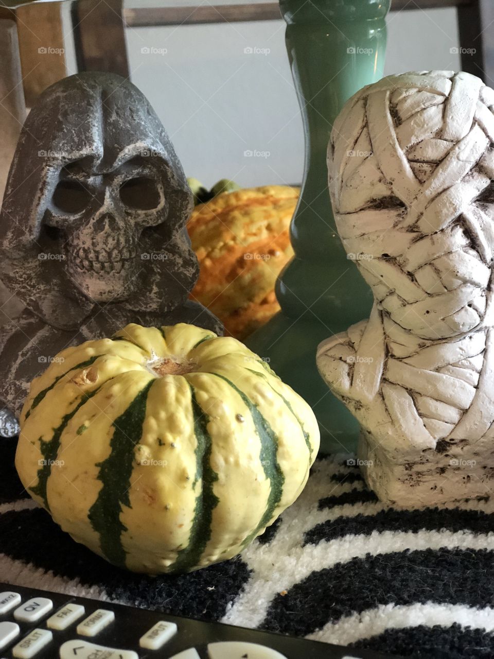 Gourds, grim reaper bust and bust of a mummy 