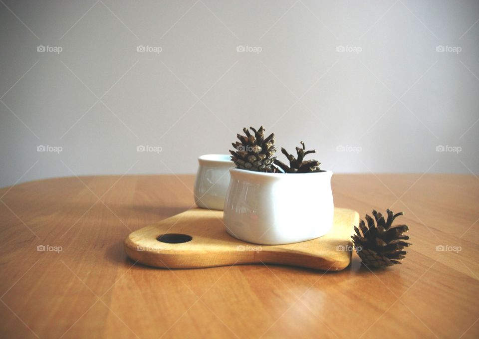 Close-up of pine cone on container