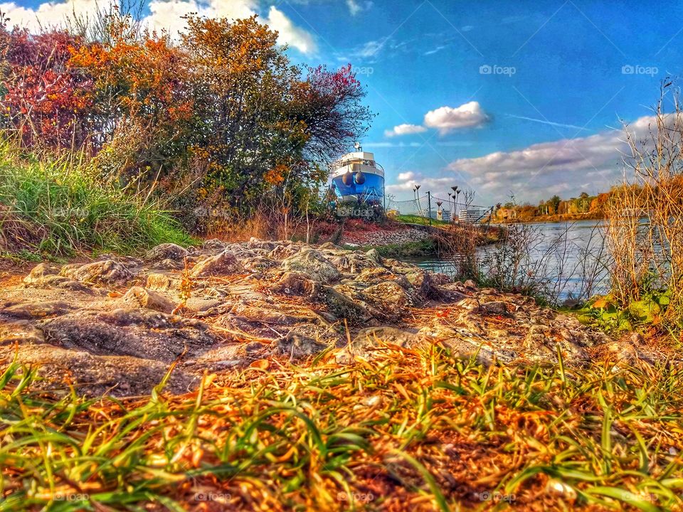 Boat at the canal in autumn