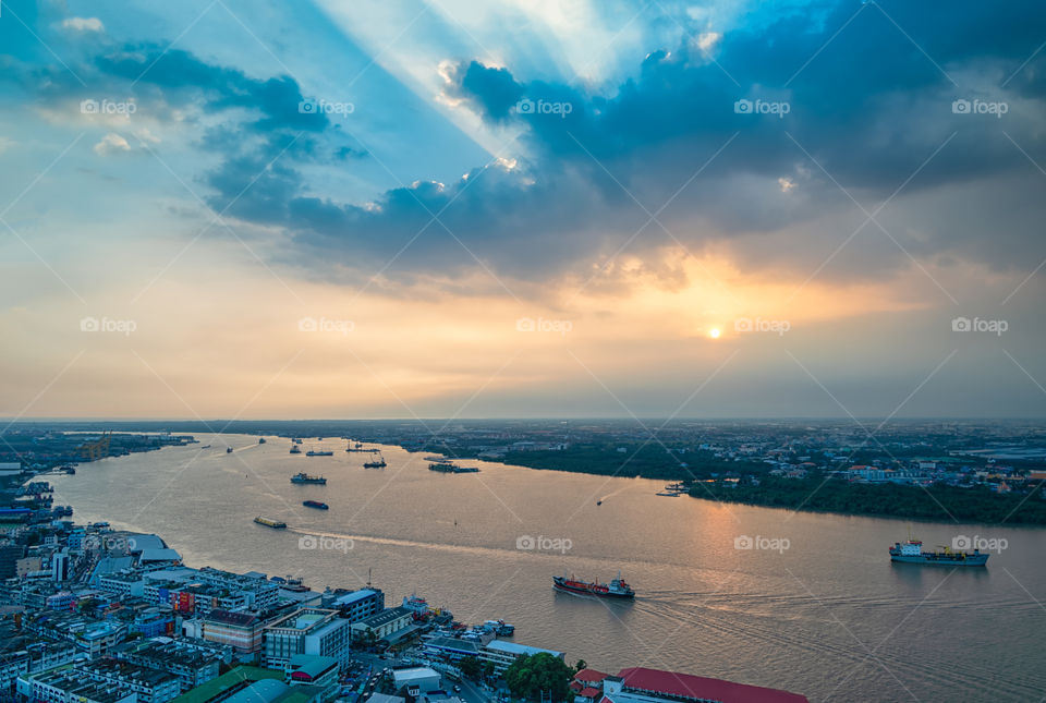 Bangkok city scape and boat in the river with beautiful sky background