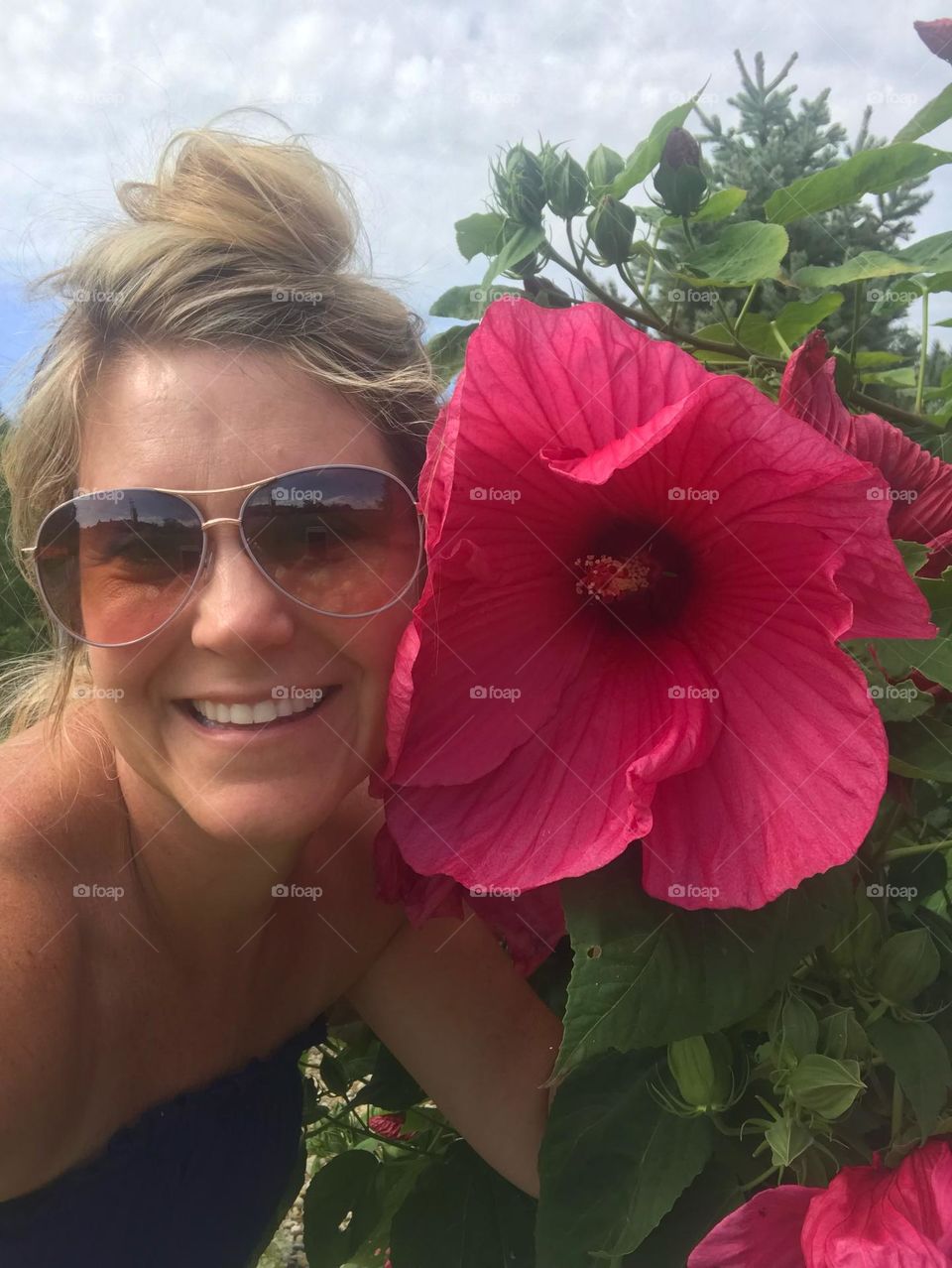 Selfie with large pink flower