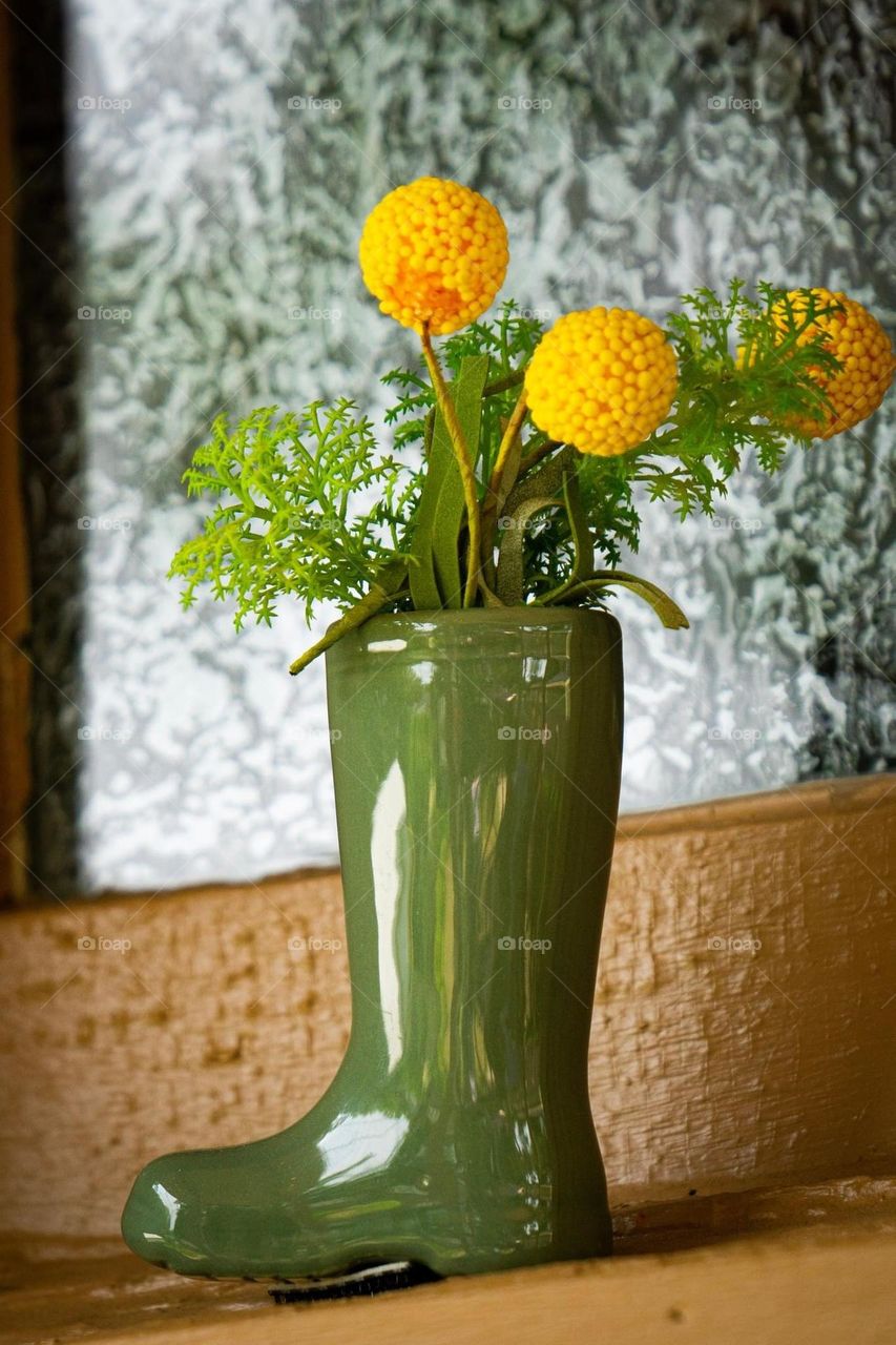 Yellow Flowers in Green Boot