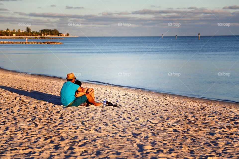 Watching the day go down!. At Key West's world famous beach, watching the sun going down behind the ocean! 