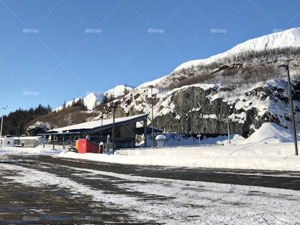 A picture with a road and snow
