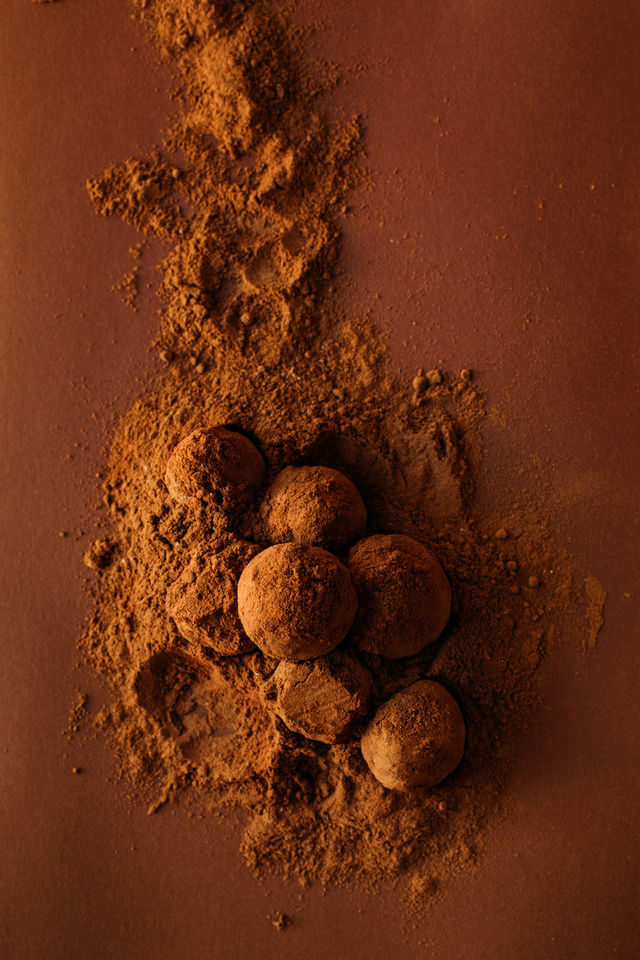 Dark brown chocolate cocoa balls in cocoa powder