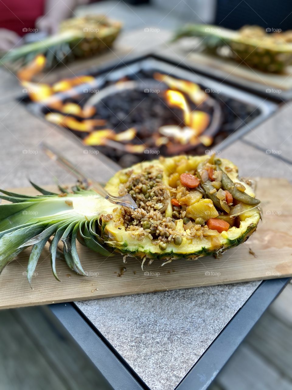 Chicken stir fry served in a pineapple by the fire pit screams summer.  It looked and tasted great!