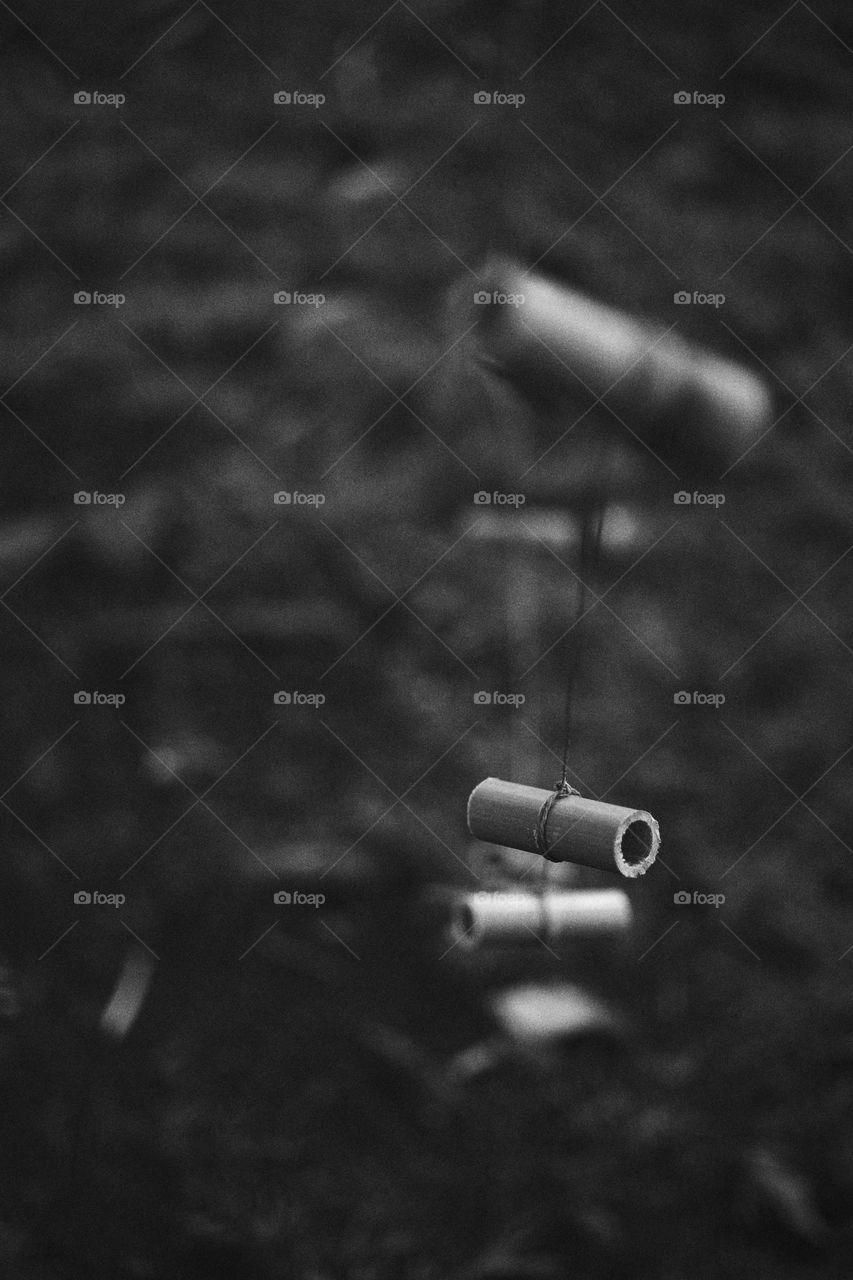Small bamboo tubes attached by a string