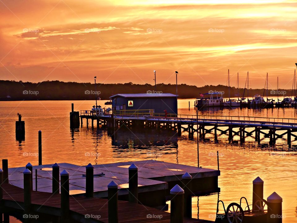 Gas storage station - The sunset symbolizes the completion of a day’s work and shows the passage of time. As the sun sets, it is time to end the day and take a break.