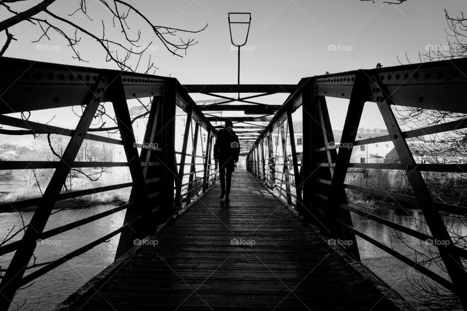 Walking over a bridge .. Barnard Castle, England , UK