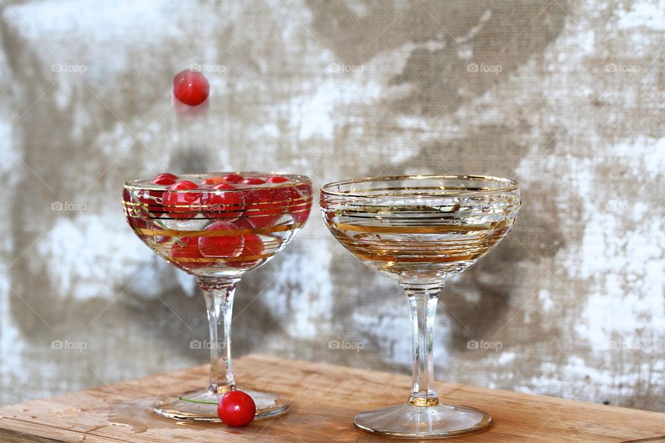 red cherry and two champagne glasses