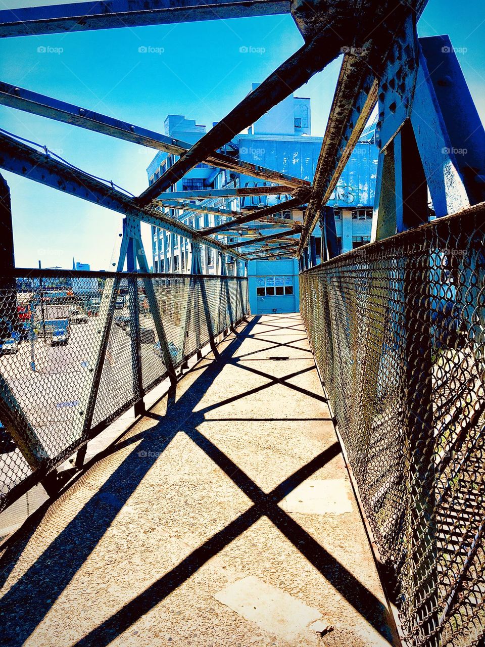 This masterpiece of modern art is a metal overpass off “Borden Avenue” in LIC, Queens. The angled structures cast intricate interwoven shadows onto the walkway of the overpass. 2020. Hypnotic Productions