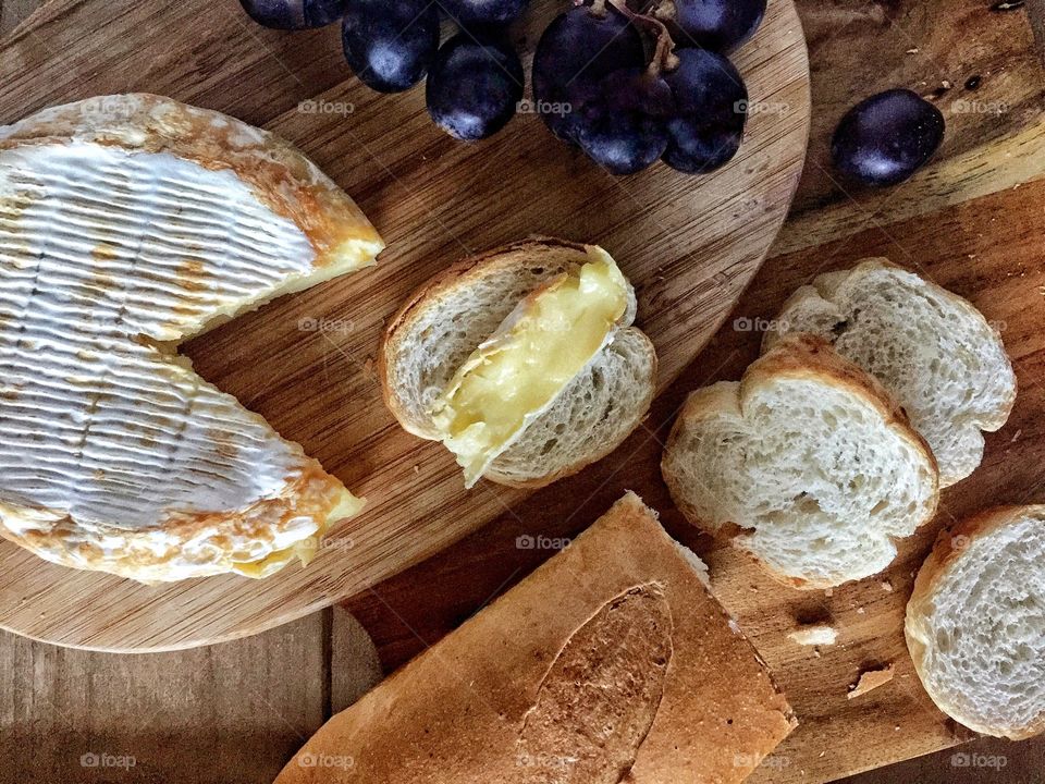 Grilled camembert cheese with baguette and grapes