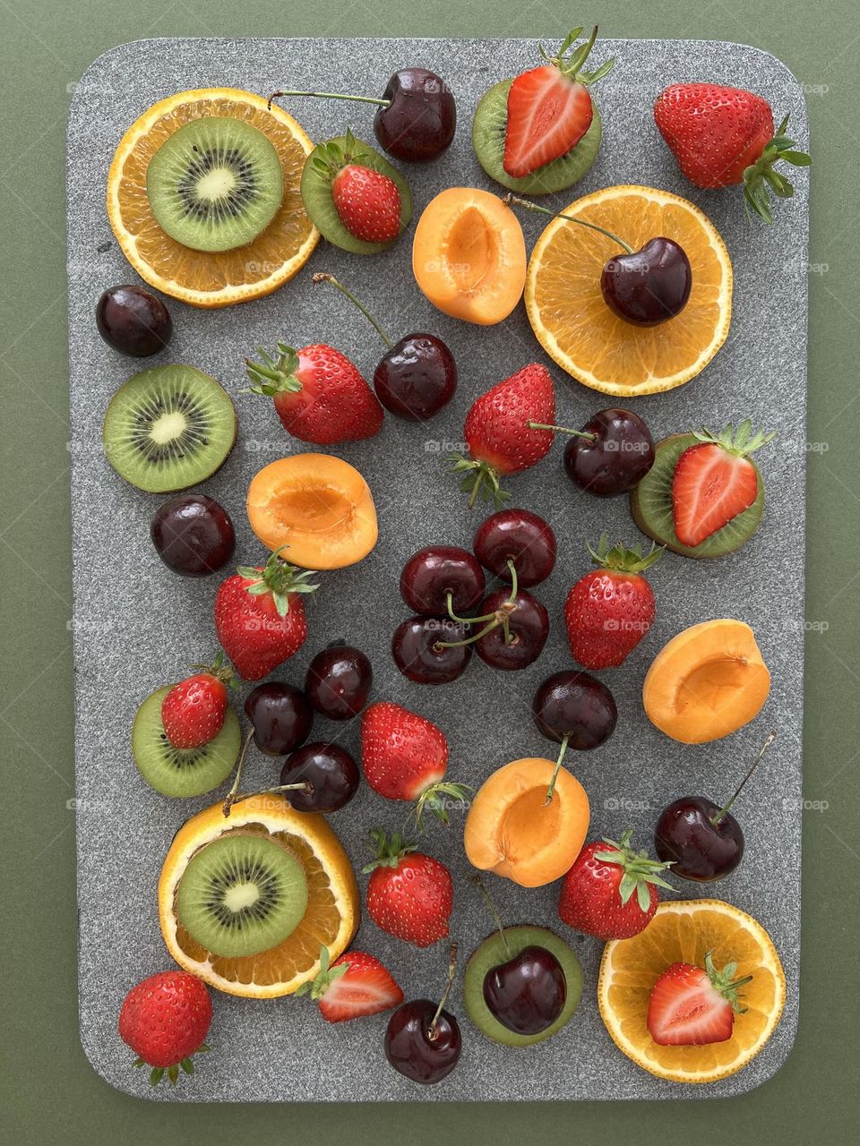 Refreshing snacks. Delicious summer berries and fruits. Summer treats, summer time. Juicy cherry ,sweet strawberry, yummy apricot, tasty orange and kiwi.